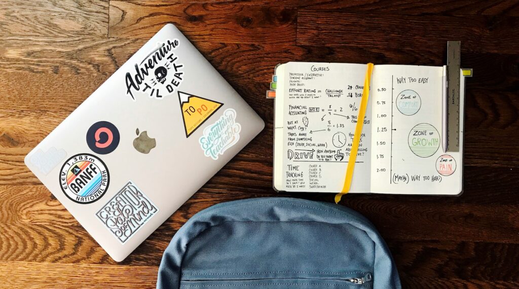 Student book and laptop on table studying showing hard subjects