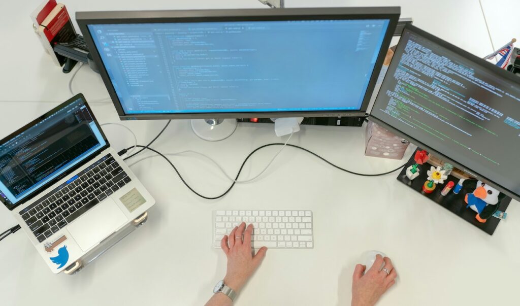 Woman typing on computer screens showing quantum computing as a growth career